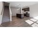 Open-concept kitchen with island, stainless steel appliances, and modern finishes at 260 Chesapeake Commons St # 156, Garner, NC 27529