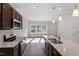 Modern kitchen showcasing stainless steel appliances and an island with seating at 260 Chesapeake Commons St # 156, Garner, NC 27529