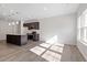Open kitchen with stainless appliances, dark cabinetry, island and recessed lighting at 260 Chesapeake Commons St # 156, Garner, NC 27529
