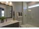 Contemporary bathroom with a glass-enclosed shower, modern vanity, and elegant fixtures at 306 Golden Leaf Farms Rd, Angier, NC 27501