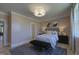 Relaxing bedroom featuring natural light, ensuite, stylish furnishings, and a neutral color palette at 306 Golden Leaf Farms Rd, Angier, NC 27501