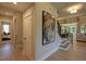 Grand foyer showcasing a staircase, modern art, and hardwood flooring at 306 Golden Leaf Farms Rd, Angier, NC 27501