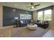 Comfortable living room with a large sectional sofa, modern rug, and stylish decor at 306 Golden Leaf Farms Rd, Angier, NC 27501