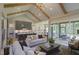 Bright living area connected to the kitchen and a screened-in porch, perfect for indoor-outdoor living at 306 Golden Leaf Farms Rd, Angier, NC 27501