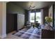 Stylish home office featuring modern lighting, a patterned rug, and functional workspace at 306 Golden Leaf Farms Rd, Angier, NC 27501