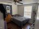 Simple bedroom with hardwood floors and a ceiling fan, providing a comfortable and functional space at 3117 Cheek Rd, Durham, NC 27704