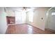 Inviting living room with hardwood floors, a brick fireplace, and lots of natural light from the windows at 3117 Cheek Rd, Durham, NC 27704