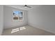 Bedroom with carpet flooring and a large window provides ample natural light at 35 Wheatfield Ln, Youngsville, NC 27596