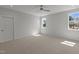 Bedroom with carpet flooring, large windows bringing in plenty of natural light, and a ceiling fan at 35 Wheatfield Ln, Youngsville, NC 27596