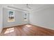 Spacious bedroom features tray ceilings, two windows and hardwood flooring at 35 Wheatfield Ln, Youngsville, NC 27596
