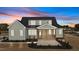 The back of this home shows off the outdoor porch and lovely green paint at 35 Wheatfield Ln, Youngsville, NC 27596