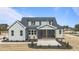 The backyard shows off this charming home with a covered porch and beautiful details at 35 Wheatfield Ln, Youngsville, NC 27596