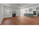 Open-concept living room boasts a fireplace, wood floors, and seamless flow to the modern kitchen at 35 Wheatfield Ln, Youngsville, NC 27596