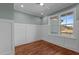 Office with white walls, wainscoting, and hardwood floors at 35 Wheatfield Ln, Youngsville, NC 27596