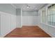 Office featuring wainscoting, hardwood floors and neutral wall paint at 35 Wheatfield Ln, Youngsville, NC 27596