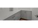 A butler's pantry with white cabinets, quartz countertops, and stainless steel hardware at 35 Wheatfield Ln, Youngsville, NC 27596