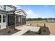 Covered porch with patio, with a lovely view of the outside area at 35 Wheatfield Ln, Youngsville, NC 27596