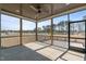 Screened-in porch featuring a ceiling fan and a view of the surrounding nature at 35 Wheatfield Ln, Youngsville, NC 27596