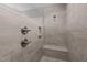 Walk-in shower with rainfall shower head, bench and tile surround at 35 Wheatfield Ln, Youngsville, NC 27596