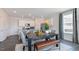 Stylish dining area open to the kitchen boasts stainless steel appliances and natural light at 523 Old Battle Bridge Rd, Wendell, NC 27591