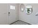 Bright entryway with modern mirrors, sleek door, and stylish rug at 523 Old Battle Bridge Rd, Wendell, NC 27591