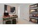 Stylish hallway with unique decor, a record player, and a bookshelf at 523 Old Battle Bridge Rd, Wendell, NC 27591
