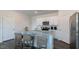 Bright kitchen features stainless steel appliances, granite countertops, and a large island with barstool seating at 523 Old Battle Bridge Rd, Wendell, NC 27591