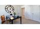 Bright office space with desk, chair, and a large decorative wall clock at 523 Old Battle Bridge Rd, Wendell, NC 27591