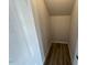 Storage closet featuring wood look floors and a white door at 55 E Victory View. Ter, Smithfield, NC 27577