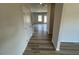 Inviting hallway with wood-look flooring leading to a bright and airy living space at 55 E Victory View. Ter, Smithfield, NC 27577