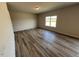 Expansive living room with luxury vinyl plank flooring and natural light at 55 E Victory View. Ter, Smithfield, NC 27577