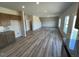 Open-concept living space combining kitchen and living areas with luxury vinyl plank flooring at 55 E Victory View. Ter, Smithfield, NC 27577