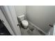 New powder room featuring a standard toilet, neutral paint and gray tile at 55 E Victory View. Ter, Smithfield, NC 27577
