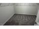 Spacious walk-in closet featuring wire shelving, carpet and neutral paint at 55 E Victory View. Ter, Smithfield, NC 27577