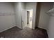 Walk-in closet with neutral paint, carpet, wire racks and access to the bathroom at 55 E Victory View. Ter, Smithfield, NC 27577