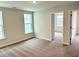 Bedroom with neutral carpet, neutral walls, and lots of natural light at 62 Blue Iris Pkwy # 125, Clayton, NC 27520