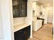 New kitchen has white cabinets, stainless steel appliances, a pantry, and quartz countertops at 62 Blue Iris Pkwy # 125, Clayton, NC 27520