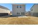 Backyard view showcasing the home's exterior and lawn at 70 Hawksbill Dr, Franklinton, NC 27525