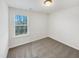 A bright bedroom featuring neutral carpet, fresh paint, and a window with natural light at 70 Hawksbill Dr, Franklinton, NC 27525