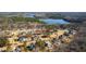 An aerial view shows the neighborhood's beautiful homes, many with swimming pools, and mature trees at 7212 Summer Tanager Trl, Raleigh, NC 27614