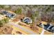 Aerial view of a neighborhood featuring well-maintained lawns and mature trees surrounding homes at 7212 Summer Tanager Trl, Raleigh, NC 27614