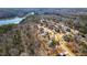 An aerial view shows the neighborhood's beautiful homes, mature trees, and quiet, paved streets at 7212 Summer Tanager Trl, Raleigh, NC 27614