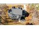 Aerial view showing the home's layout, roof design, screened porch, and back patio at 7212 Summer Tanager Trl, Raleigh, NC 27614