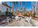 Inviting backyard featuring a gravel firepit area with seating, perfect for outdoor gatherings at 7212 Summer Tanager Trl, Raleigh, NC 27614