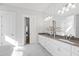 Large bathroom with double vanity and luxurious soaking tub, creating a spa-like experience at 7212 Summer Tanager Trl, Raleigh, NC 27614