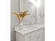 Bathroom featuring a white vanity with marble countertop, perfect for a clean and modern look at 7212 Summer Tanager Trl, Raleigh, NC 27614