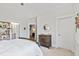 Bedroom featuring neutral walls, carpet, and a doorway leading to the ensuite bathroom at 7212 Summer Tanager Trl, Raleigh, NC 27614