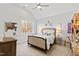 This carpeted bedroom with decor and large window offers natural lighting at 7212 Summer Tanager Trl, Raleigh, NC 27614