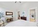 Bright bedroom with light-colored carpet, featuring a decorative table and chair at 7212 Summer Tanager Trl, Raleigh, NC 27614