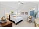 Vaulted ceiling bedroom with carpet and white walls, featuring two windows for natural light at 7212 Summer Tanager Trl, Raleigh, NC 27614